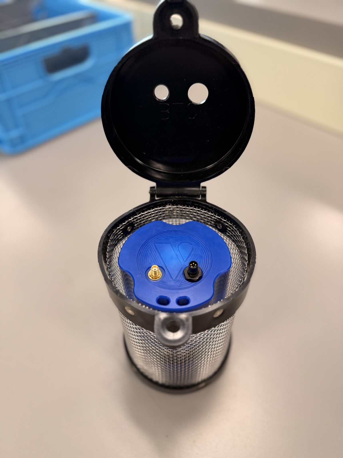 Lume seated inside the cage with connectors facing the lid